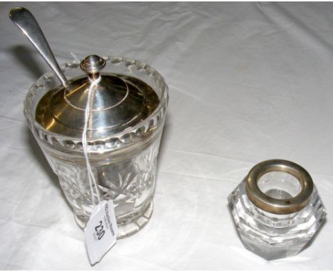 An Art Deco style silver top and cut glass marmalade jar, together with a silver rimmed jar