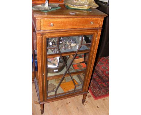 An Edwardian display cabinet with single drawer to the front