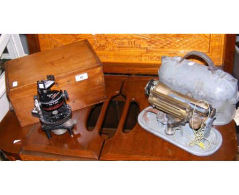 An old Astro compass, together with theodolite in carrying case