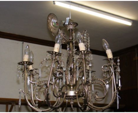 A decorative eight branch and crystal drop ceiling light