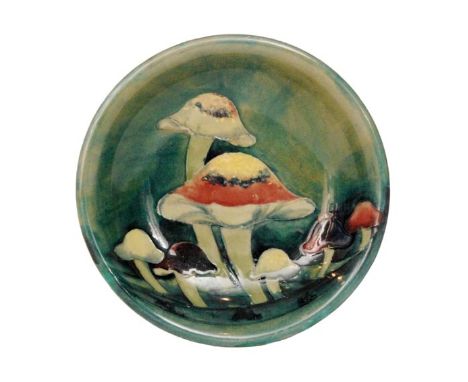 William Moorcroft - Claremont - A shallow dish decorated with tubelined toadstools against a green wash ground, impressed mar