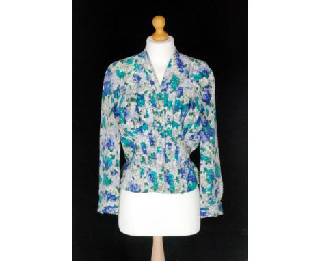 Christian Dior - A 1950s silk blouse with long sleeves, a ruched panel button front with a peplum, the whole in a tonal green