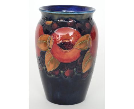 William Moorcroft - Pomegranate - A vase of baluster form with an everted rim decorated with an upper band of open and whole 