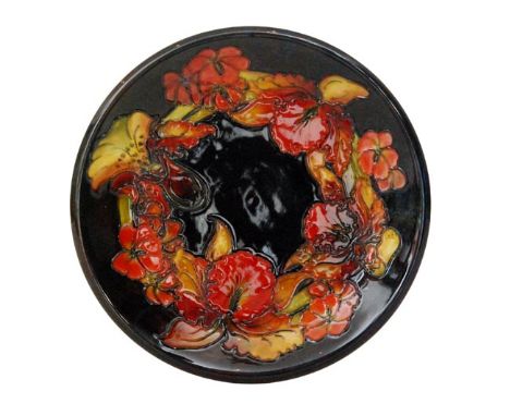 Walter Moorcroft - Flambe Frilled Orchid - A shallow plate decorated with a band of slipper orchids and flower heads against 