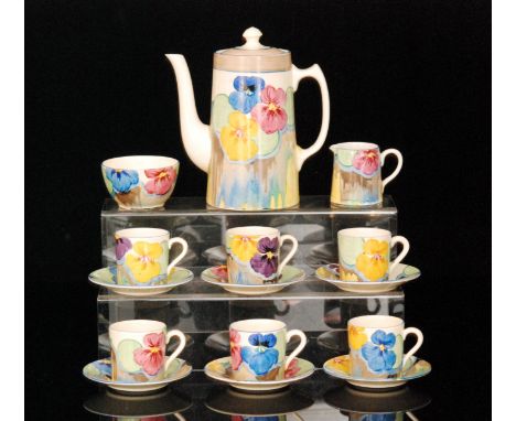 Clarice Cliff - Delecia Pansies - A Tankard shape coffee service circa 1932 comprising coffee pot, cream, sugar, six cups and