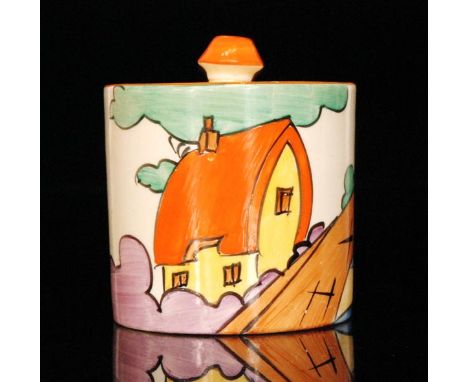 Clarice Cliff - Orange Roof Cottage - A drum preserve circa 1932, hand painted with a stylised cottage and bridge landscape w
