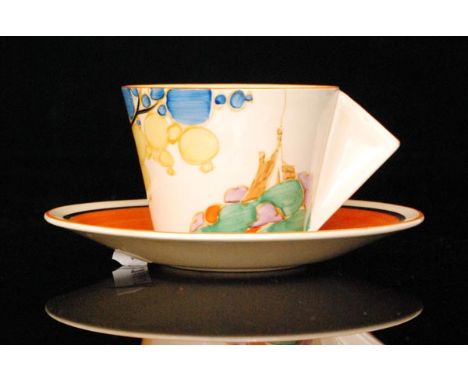 Clarice Cliff - Seven Colour Secrets - A conical shape cup and saucer circa 1935, hand painted with a stylised coastal tree a