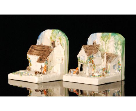 Clarice Cliff - Cottage Bookends - A pair of shape 411 novelty book ends circa 1934 modelled as country houses with figures a