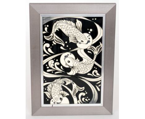 Rachel Bishop - Moorcroft Pottery - A framed tile decorated with three tubelined swimming carp, all in black and white, impre
