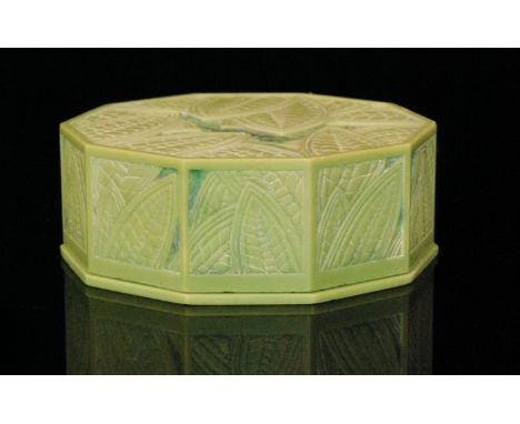 Eduard Fornells (1887-1942) - An Art Deco ten sided green urea formaldehyde box, the lid and panel sides with carved stylised