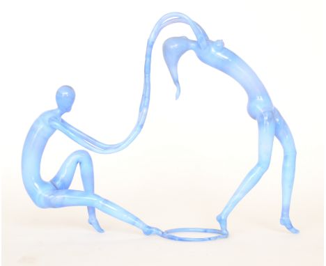 Bimini - A lamp blown blue opal glass figural group 'Entwined Dancers' modelled as a lady leaning back with her arms to a sea