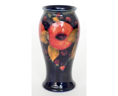 William Moorcroft - Pomegranate - A vase of footed baluster form decorated with an upper band of open and whole fruit and ber