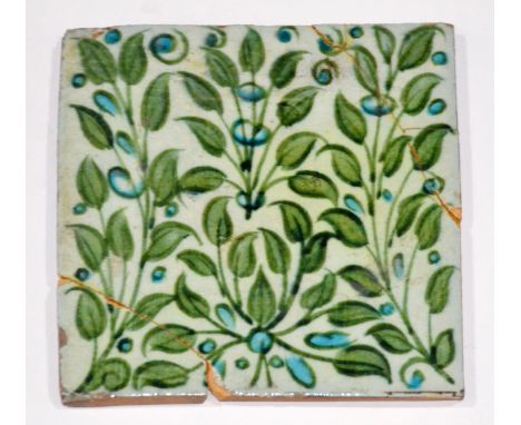 William de Morgan - Chelsea - A 6in plastic clay tile decorated with foliage and blue flowers, impressed square mark, A/F