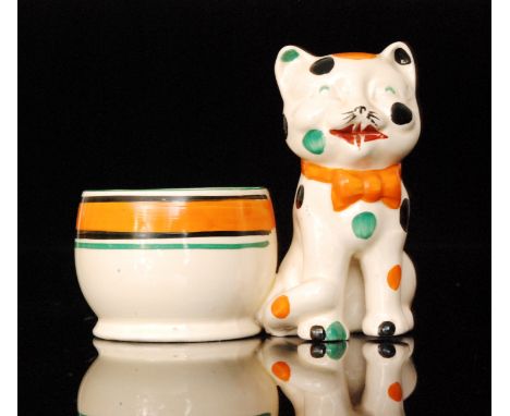 Clarice Cliff - Laughing Cat - A pen holder circa 1932 modelled as a seated cat, hand painted with black, orange and green sp