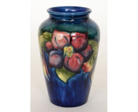 Walter Moorcroft - Clematis - A vase of high shouldered form with a roll rim neck, the body decorated with tubelined flowers 