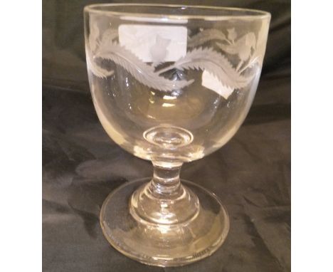 A circa 1800 drinking glass decorated with thistles, raised on a circular foot CONDITION REPORTS Approx 10 cm in height.  Has