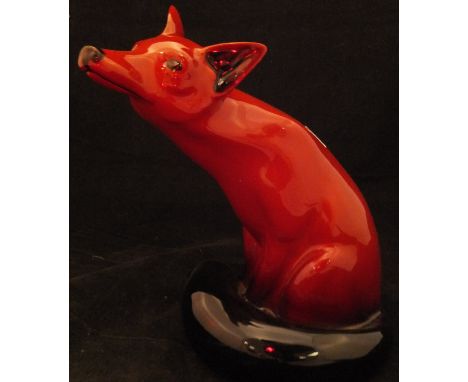 A Royal Doulton Flambé figure of a seated fox (102) 23.5 cm high CONDITION REPORTS Generally good condition, some light scrat
