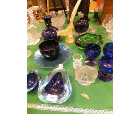 A collection of glassware to include an amethyst finger bowl, a studio glass green bowl, a 19th Century purple glass flask wi