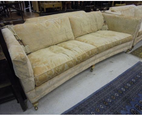 A three / four seater curved sofa with drop arms by Duresta Horatio Sofas with pale gold foliate patterned upholstery CONDITI