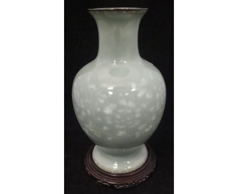 A Japanese celadon wireless cloisonne baluster shaped vase with scrolling foliate and flower head decoration with wire decora