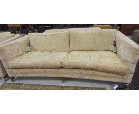 A three / four seater curved sofa with drop arms by Duresta Horatio Sofas with pale gold foliate patterned upholstery CONDITI