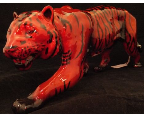 A Royal Doulton Flambé figure of a stalking tiger, 34.5 cm long CONDITION REPORTS The tiger has a scratch to the flank, some 
