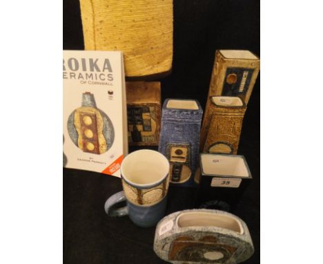 A collection of Troika Pottery to include a rectangular vase with disc decoration by Linda Thomas (early 1970's), base by Ali