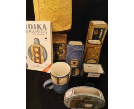 A collection of Troika Pottery to include a rectangular vase with disc decoration by Linda Thomas (early 1970's), base by Ali