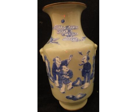 A Chinese celadon glazed vase decorated in blue and white with figures and bird amongst clouds, flanked by lion mask ring han