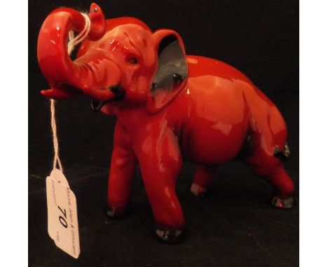 A Royal Doulton Flambé figure of an elephant with raised trunk in salute CONDITION REPORTS Some light scratches to the body t
