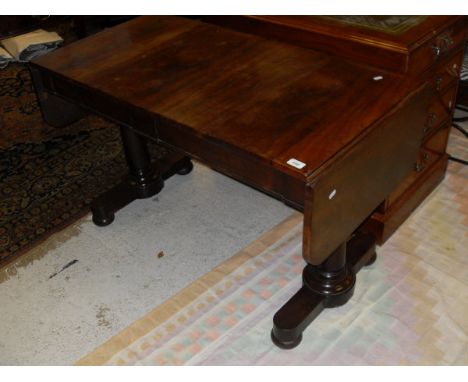 A Victorian mahogany sofa table, the plain top with two drop leaves over two frieze drawers on turned end pillar supports to 