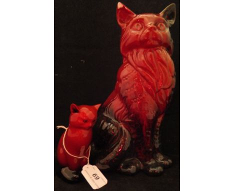A Royal Doulton Flambé veined figure of a seated cat together with a Royal Doulton Flambe figure of a seated Siamese cat COND