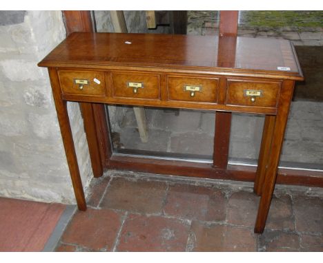 A burr oak and cross-banded side table with four short drawers labelled "Sugar", "Ginger", "Parsley" and "Bay Leaves", raised