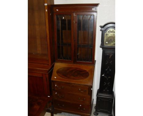 An Edwardian mahogany and inlaid bureau bookcase, the upper section with astragal glazed doors over a sloping fall front and 