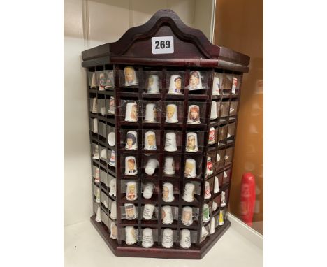 WALL MOUNTED CANTED CABINET OF CERAMIC THIMBLES INCLUDING CORONATION STREET CHARACTERS