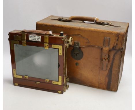 An early 20th century half plate camera by Sands, Hunter & Co. 37 Bedford Street, Strand, London WC, mahogany and brass frame