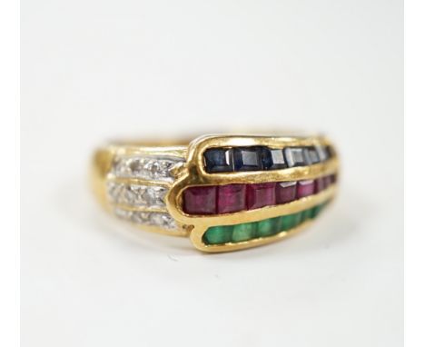 A modern 750, ruby, emerald, sapphire and diamond chip set three row ring, size I, gross weight 4.8 grams.