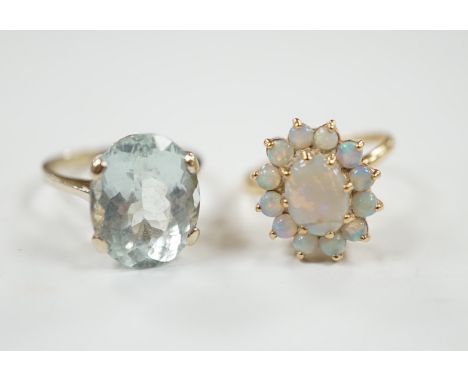 A 14k yellow metal and white opal set oval cluster ring, size P/Q, gross weight 4.1 grams and a gilt white metal? and oval fa