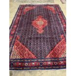 A Tabriz red ground carpet, 296 x 189cm