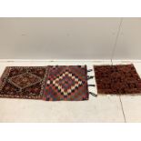 An antique Caucasian wall hanging, (converted saddlebag), width 120cm, depth 55cm, together with a