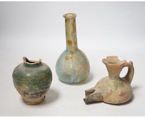 A Roman glass vessel, an Islamic pot and oil lamp, largest 18cm high (3)