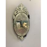 A Venetian style oval wall mirror, width 66cm, height 139cm