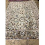 A Kashan pale green ground carpet, 310 x 207cm