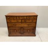 A Victorian mahogany chest fitted with an arrangement of seven drawers, width 110cm, depth 52cm,