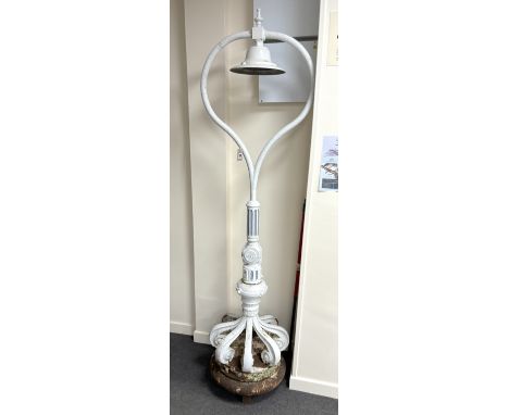 A late 19th/early 20th century cast iron promenade lamp, height 224cm.