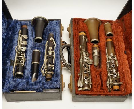 Two cased unmarked clarinets with early key systems, one mid 19th century in rosewood, one with light brown Bakelite body