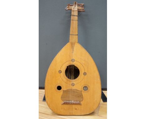 A Middle Eastern eleven string lute, overall length 82cm