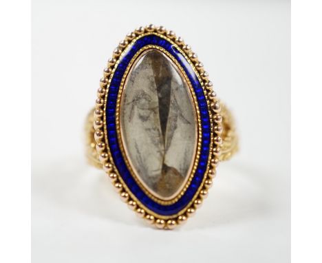 A 19th century 15ct and blue enamel set navette shaped mourning ring, with damaged inset ivory panel, size O, gross weight 5.