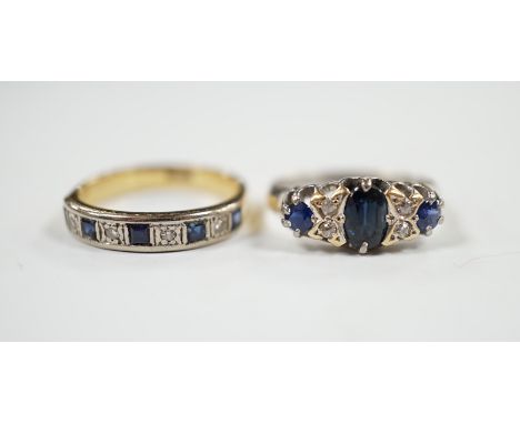 A George V 18ct white gold, sapphire and diamond cluster set ring, size K and one other 18ct, sapphire and diamond set half h