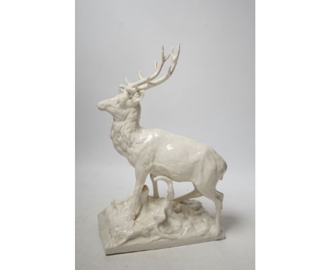 A Nymphenburg white glazed porcelain model of a stag, 31cm high One antler section detached and retained; corresponding antle
